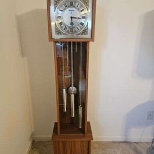 Brown Grandfather Clock with Gold Accents